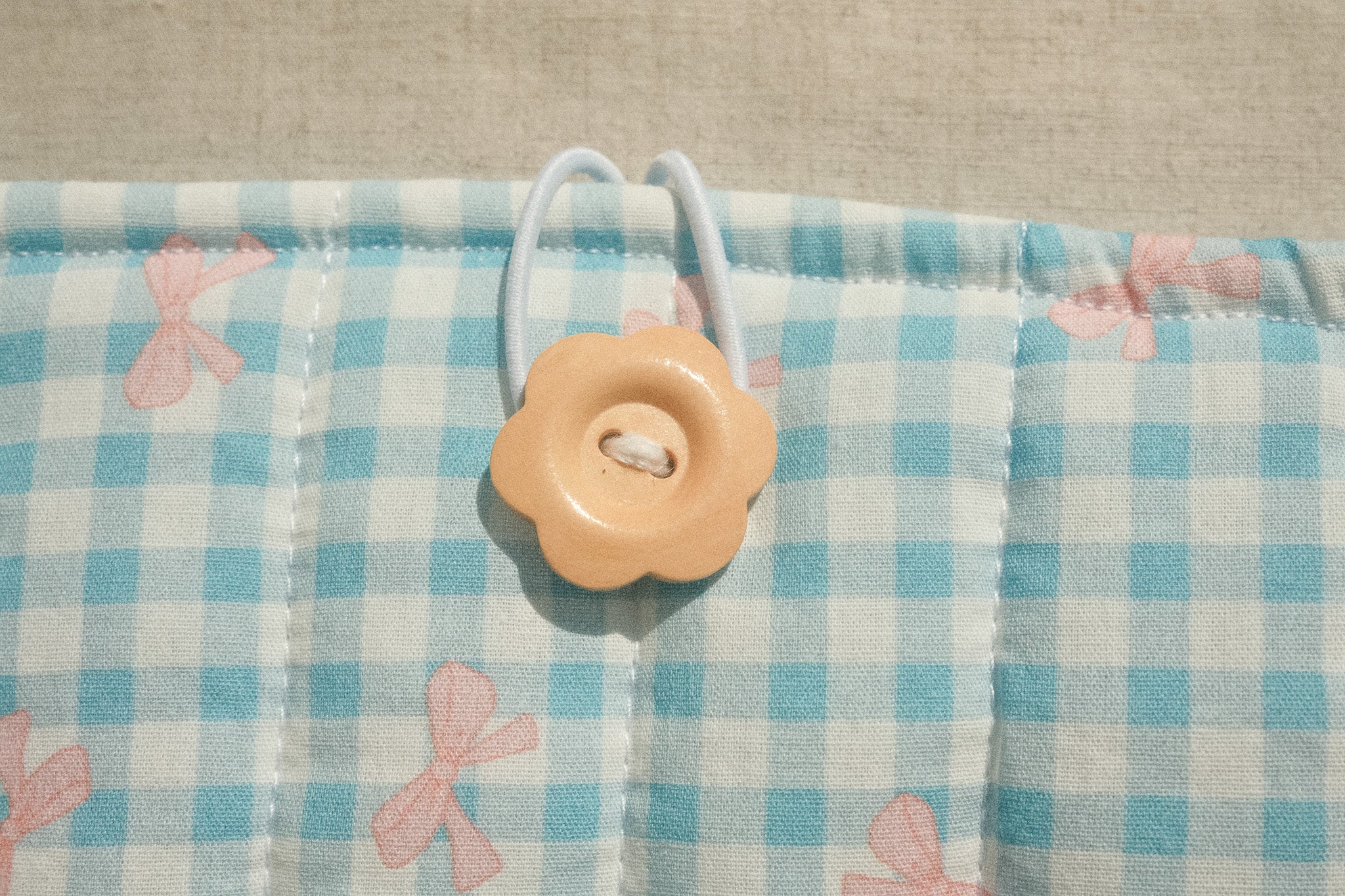Wooden flower button on booksleeve