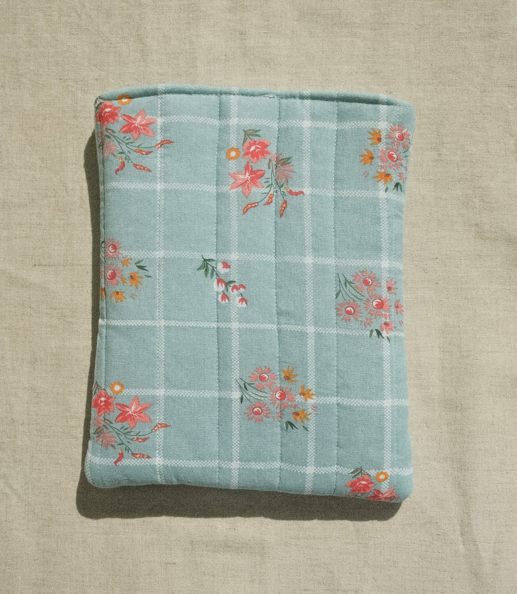Floral patterned fabric on a beige background