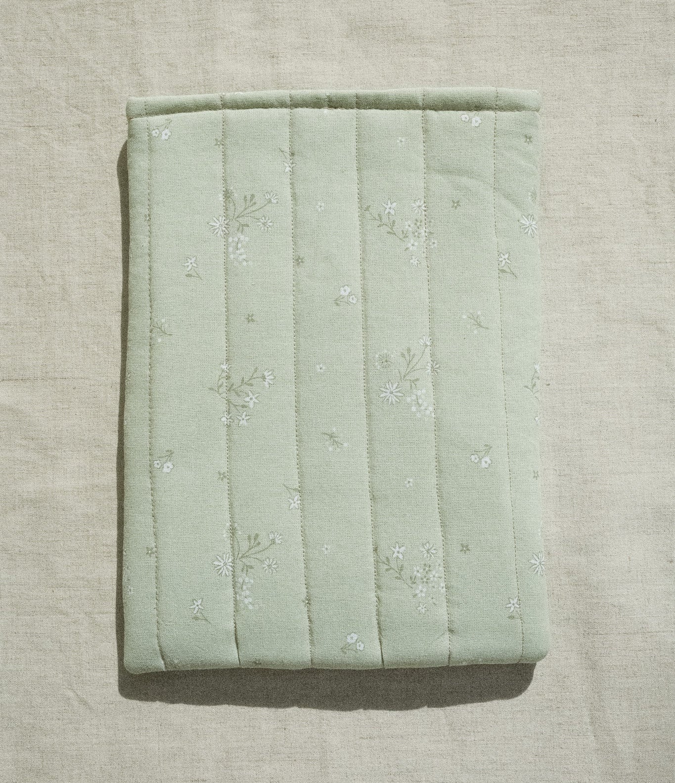 Sage booksleeve on linen background