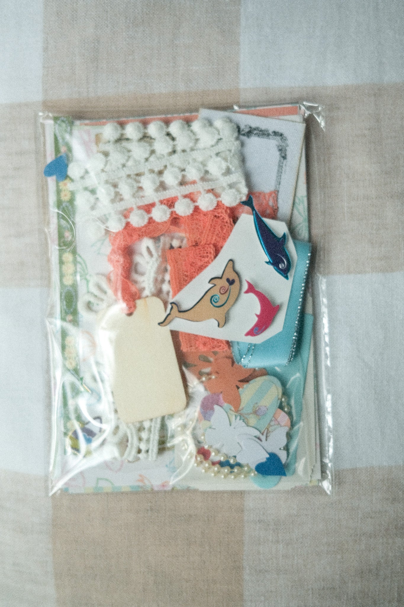 Packaged set of decorative items with cartoon characters on a textured surface